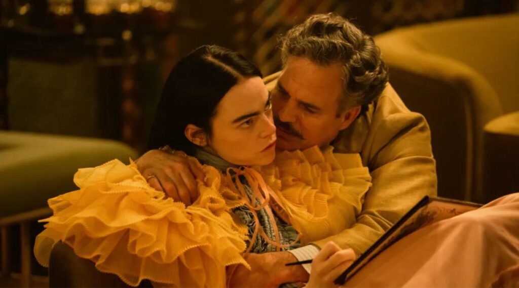 Emma Stone as Bella Baxter and Mark Ruffalo as Duncan Wedderburn in Poor Things 